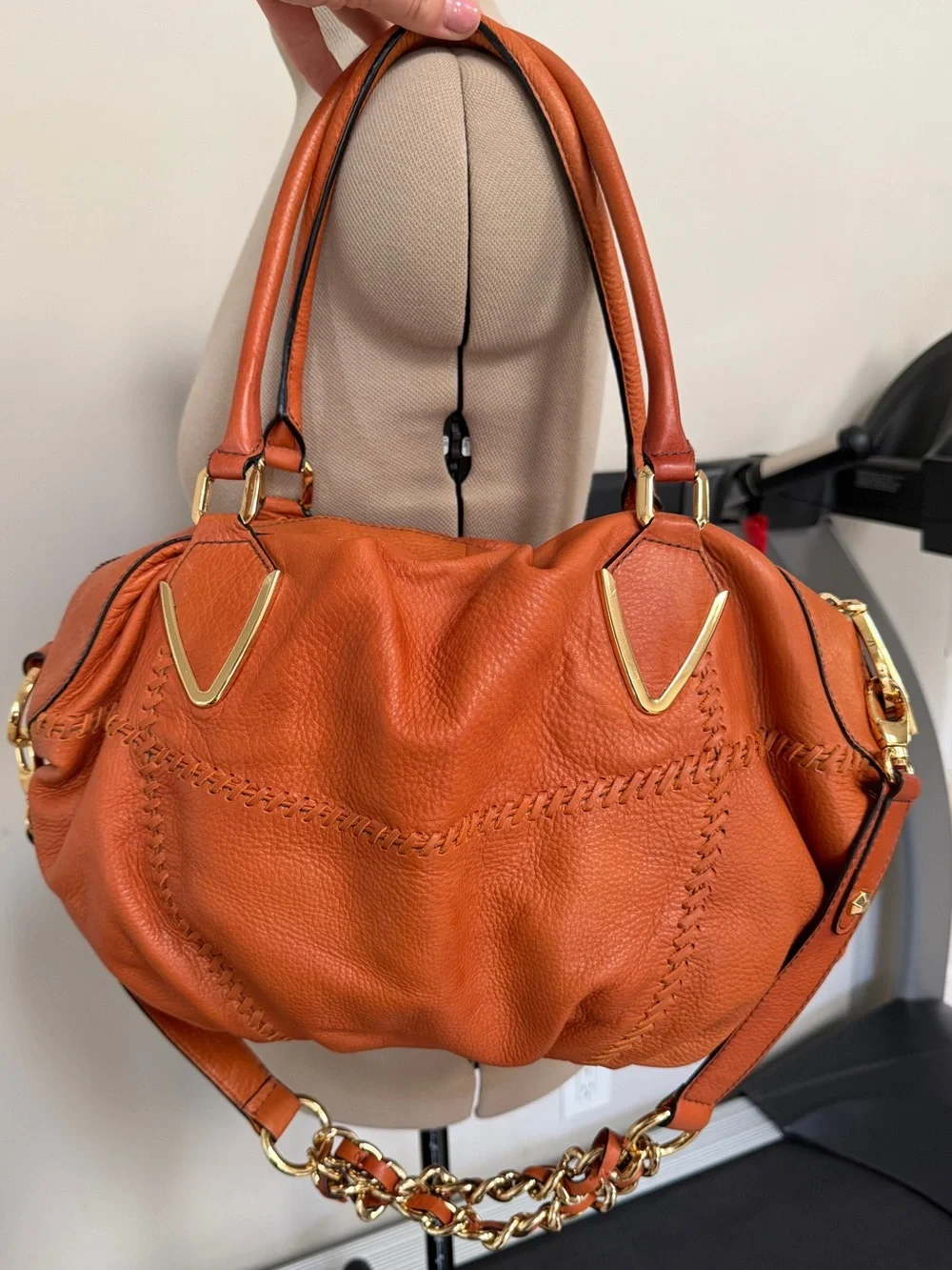 Orange leather handbag appears to be a slouchy style by orYany